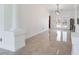 Modern living room featuring elegant tile flooring and stylish architectural columns at 7526 Gossamer Wind St, Las Vegas, NV 89139
