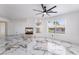 Bright living room with a modern fireplace and an eye-catching marble tile floor at 7526 Gossamer Wind St, Las Vegas, NV 89139