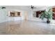 Bright living space includes a bar area, large indoor plant, and polished tile flooring at 7526 Gossamer Wind St, Las Vegas, NV 89139