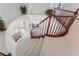 Elegant staircase with white steps and dark wood banister at 7526 Gossamer Wind St, Las Vegas, NV 89139