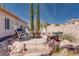 Cozy backyard patio area with a fire pit and comfortable seating perfect for outdoor relaxation at 7815 Windward Rd, Las Vegas, NV 89147