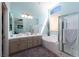 Modern bathroom features dual sinks, a soaking tub, and a separate shower, for a spa-like experience at 7815 Windward Rd, Las Vegas, NV 89147