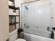 Cozy bathroom features a shower over tub, complemented by a storage rack for bath supplies at 7815 Windward Rd, Las Vegas, NV 89147