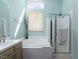 Bright bathroom has a soaking tub and a walk in shower, with lots of natural light at 7815 Windward Rd, Las Vegas, NV 89147