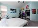 Vaulted ceiling bedroom features a king bed, artwork, and a walk in closet at 7815 Windward Rd, Las Vegas, NV 89147