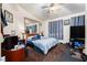 The bedroom features a ceiling fan and a large mirror on the wall at 7815 Windward Rd, Las Vegas, NV 89147