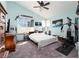 Spacious bedroom features lots of art, vaulted ceilings, a ceiling fan, and a walk in closet at 7815 Windward Rd, Las Vegas, NV 89147