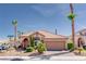 Charming single-story home featuring desert landscaping, a tile roof, and a two-car garage at 7815 Windward Rd, Las Vegas, NV 89147