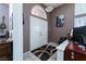 Welcoming foyer with double doors, tile flooring, and an Einstein portrait at 7815 Windward Rd, Las Vegas, NV 89147