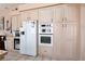 Eat in kitchen with white cabinets, built in ovens, and plenty of storage at 7815 Windward Rd, Las Vegas, NV 89147