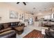 Open concept living area with tile floors, a sofa, and a view of the kitchen at 7815 Windward Rd, Las Vegas, NV 89147