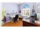 This office features hardwood floors and a white framed arched window at 7815 Windward Rd, Las Vegas, NV 89147
