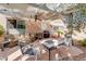 Covered patio features lounge furniture, a ceiling fan, and a grill at 7815 Windward Rd, Las Vegas, NV 89147