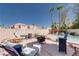Beautiful backyard featuring a refreshing pool with a waterfall feature and lounge chairs for relaxing at 7815 Windward Rd, Las Vegas, NV 89147