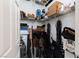 Walk-in closet features metal shelving, and it is full of items at 7815 Windward Rd, Las Vegas, NV 89147
