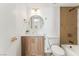 Bright bathroom with modern fixtures, a wood vanity, and tub-shower combination with stylish tiling at 7932 Diamond Rock Way # 101, Las Vegas, NV 89128
