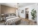 Cozy bedroom with stylish decor, wood-look flooring, and a well-lit ambiance at 7932 Diamond Rock Way # 101, Las Vegas, NV 89128
