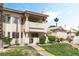 Charming condo complex featuring well-kept grounds, mature trees, and stucco siding at 7932 Diamond Rock Way # 101, Las Vegas, NV 89128