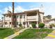 Attractive condo building showcasing well-maintained landscaping and stucco facade at 7932 Diamond Rock Way # 101, Las Vegas, NV 89128
