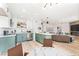 Open-concept kitchen featuring an island, stainless appliances, and a seamless transition to the living area at 7932 Diamond Rock Way # 101, Las Vegas, NV 89128