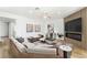 Modern living room featuring a large sectional sofa, contemporary decor, and stylish fireplace at 7932 Diamond Rock Way # 101, Las Vegas, NV 89128