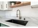 Modern kitchen sink with quartz countertop and designer faucet at 7932 Diamond Rock Way # 101, Las Vegas, NV 89128