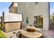 Private backyard patio with a hot tub and charming mosaic-tiled outdoor dining area at 8016 Carpenter Creek Ave, Las Vegas, NV 89113
