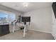 Bedroom with modern workstation setup, including dual monitors, adjustable desk, and a comfortable chair at 8016 Carpenter Creek Ave, Las Vegas, NV 89113