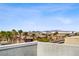 Attractive community view with palm trees accenting the well-maintained apartment buildings against a blue sky at 8016 Carpenter Creek Ave, Las Vegas, NV 89113