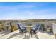 Rooftop deck featuring patio furniture, mountain views, and surrounding neighborhood landscapes at 8016 Carpenter Creek Ave, Las Vegas, NV 89113