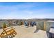Inviting rooftop patio featuring lounge seating and panoramic views of the surrounding landscape at 8016 Carpenter Creek Ave, Las Vegas, NV 89113