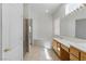 This bright bathroom features a glass enclosed shower and a soaking tub with natural light at 8114 Lapis Harbor Ave, Las Vegas, NV 89117
