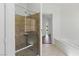 Elegant bathroom features a tiled walk-in shower and a separate soaking tub at 8114 Lapis Harbor Ave, Las Vegas, NV 89117