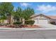Charming single-story home with a well-manicured front yard and a two-car garage at 8114 Lapis Harbor Ave, Las Vegas, NV 89117