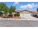 Charming single-story home with a well-maintained lawn and a two-car garage, located in a quiet neighborhood at 8114 Lapis Harbor Ave, Las Vegas, NV 89117