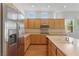 Bright and spacious kitchen with stainless steel appliances, wood cabinets, and plenty of natural light at 8114 Lapis Harbor Ave, Las Vegas, NV 89117