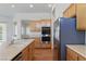 Functional kitchen featuring modern appliances, ample counter space, and wood cabinetry, designed for easy meal preparation at 8114 Lapis Harbor Ave, Las Vegas, NV 89117