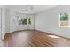 A bright, spacious living room boasts natural light and beautiful flooring throughout the space at 8114 Lapis Harbor Ave, Las Vegas, NV 89117