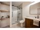 Bathroom featuring a glass shower, modern vanity, floating shelves and decorative tile flooring at 8140 Bay Harbor Dr, Las Vegas, NV 89128