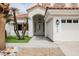 Inviting home entrance with a covered porch and well manicured landscape at 8140 Bay Harbor Dr, Las Vegas, NV 89128