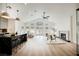 Open-concept living area with high ceilings, hardwood floors, fireplace and backyard view at 8140 Bay Harbor Dr, Las Vegas, NV 89128