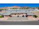 Low-rise apartment complex featuring brick facade, individual entrances, and ample parking at 820 A Ave, Boulder City, NV 89005