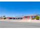 Well maintained low-rise apartment complex with red brick, pedestrian walkways and front parking at 820 A Ave, Boulder City, NV 89005