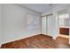 Empty room with wood floors, a sliding closet, and a window with horizontal blinds at 8236 Bermuda Beach Dr, Las Vegas, NV 89128
