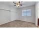 Bedroom with a ceiling fan, window, and built in shelving at 8236 Bermuda Beach Dr, Las Vegas, NV 89128