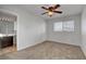 Bedroom featuring a ceiling fan and an adjoining bathroom at 8236 Bermuda Beach Dr, Las Vegas, NV 89128