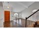 Open entryway displaying hardwood floors, a wooden door with stained glass, and a staircase at 8236 Bermuda Beach Dr, Las Vegas, NV 89128