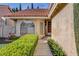 Inviting single-Gathering home showcasing a mature lawn, lush hedges, and beautiful landscaping at 8236 Bermuda Beach Dr, Las Vegas, NV 89128