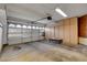 Spacious garage with ample storage cabinets and an automatic door, ready for parking and projects at 8236 Bermuda Beach Dr, Las Vegas, NV 89128