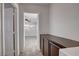 Hallway with built-in cabinets, with a view into a well-lit bedroom at 8236 Bermuda Beach Dr, Las Vegas, NV 89128